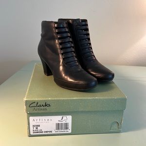 Clarks Artisan black leather booties with side zippers, size 7 M.